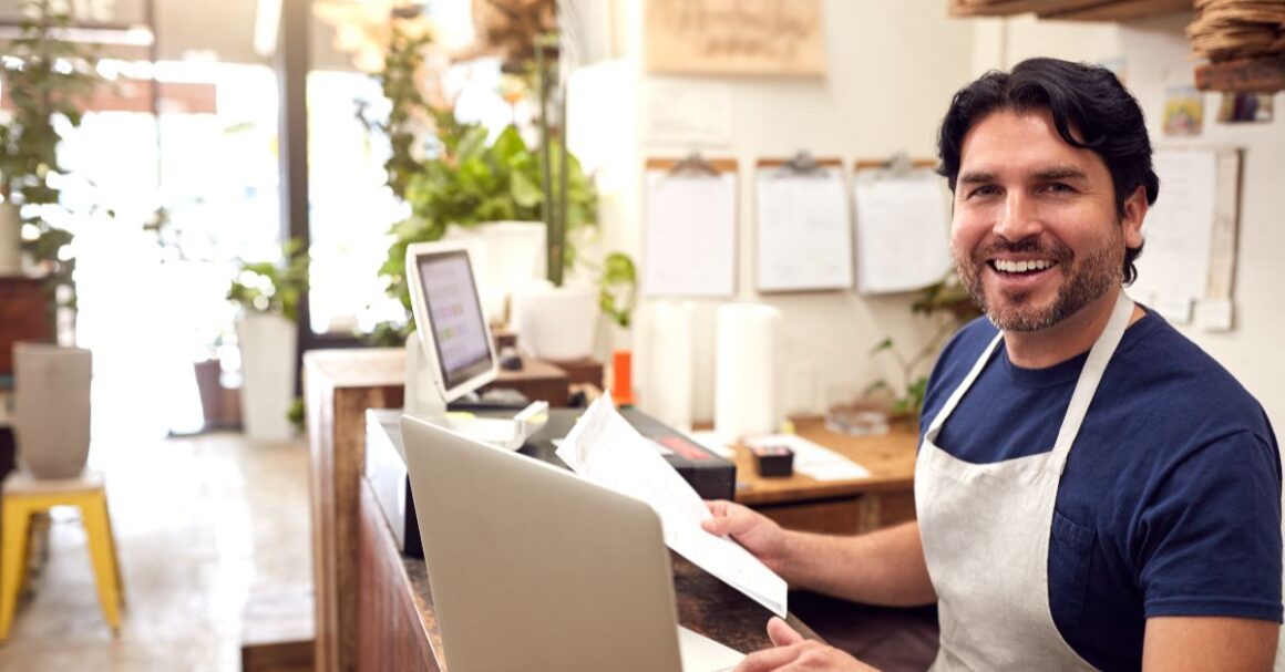 smilingmanworkingatalaptopinsideshop20260922181753utc 1 ND Professional Services