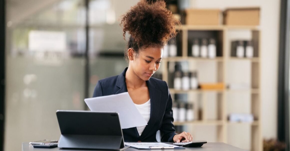 womancalculatingfinancesatdeskwithtablet20260924030449utc 1 ND Professional Services